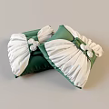 Green And White Decorative Pillows With Ruched Details And White Flower Accents
