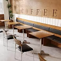 Modern Coffee Shop Interior With Bench Seating Wooden Tables Chairs And COFFEE Wall Sign