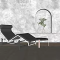 Modern Leather Chaise Lounge With Metal Frame Side Table And Potted Plant In Arched Niche