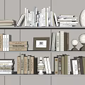 White Bookshelf With Collection Of Books Photo Frame Vase And Spherical Decor