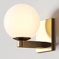 Modern Minimalist Wall Lamp With White Spherical Lampshade And Brass Metal Bracket Mounted On Wall