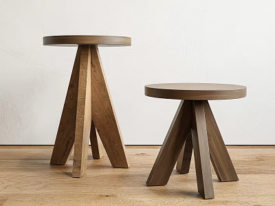Two Wooden Stools With Round Seats Three Legs Light And Dark Wood Tones On Wooden Floor 3d model