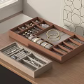 Elegant Open Jewelry Box With Organized Various Bracelets Rings Earrings On Wooden Desk