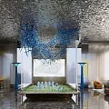 Modern Sales Office Interior Featuring Textured Ceiling Hanging Blue Art Installation And Property Model