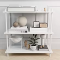 White Multi tiered Side Table With Open Shelves Books Decorative Items And Potted Plant