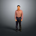 The Man Standing Against Gray Background In Pink Shirt Dark Pants And Black Shoes