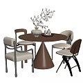 Round Wooden Dining Table With Four Chairs White Cushioned Seats And Decorative Vase With Dried Branches