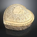 Ornate Golden Heart Shaped Box With Intricate Patterns For Jewelry Storage