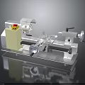 Industrial Lathe Machine With Yellow Control Panel And Rotating Metal Components