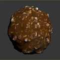 Caramel Colored Nutty Candy Ball with Glossy Texture and Crunchy Nut Pieces
