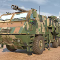 Military Functional Vehicle Featuring Camouflage Design Large Wheels And Top Mounted Weapon System