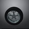 Sturdy Black Rubber Tire With Shiny Metallic Silver Car Wheel Rim And Modern Spoke Design