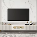 Stylish Striped TV Stand With Gold Legs And Decorative Items Against White Marble Wall