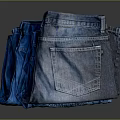 Classic Blue Denim Jeans With Stylish Pocket Design Stacked On Dark Surface
