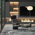 Modern Living Room Featuring Comfortable Recliner Chair Ottoman Near Fireplace Floor Lamp and Bookshelves