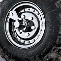 Off Road Tire Featuring Worn Tread And New Wheel Hub Mechanical Parts