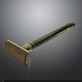 Vintage Design Safety Razor With Green Textured Handle And Brass Accents As Household Essential