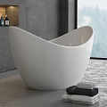 Modern White Freestanding Bathtub In Bathroom With Grey Walls And Towels