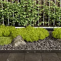 Green Garden Landscaping With Lattice Fence Shrubs Grasses And Stones On Dark Tiles