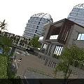 Luxurious Garden Landscape with Lush Green Lawn Tall Palm Trees Modern Buildings and Colorful Flower Beds