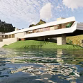 Modern Office Building With Glass Curtain Wall Green Roof And Waterfront Surroundings