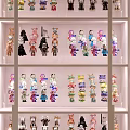 Organized Action Figure Display Cabinet With Colorful Collectibles And Multiple Shelves
