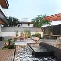 Stylish Courtyard Garden Landscape With Outdoor Dining Table Lush Plants And Trickling Water Feature
