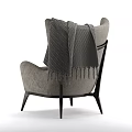 Modern Gray Armchair With Knitted Blanket And Black Wooden Legs