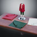 Mannequin In Red Coat And Green Pants With Fabric Pieces And Ruler On Wooden Table