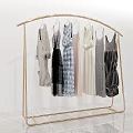 Golden Metal Clothes Rack With Various Stylish Dresses For Modern Retail