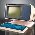 Vintage Computer Monitor With Green Screen And Blue Keyboard