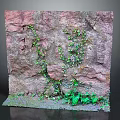 Natural Rock Surface With Lush Green Plants And Moss Growing On It
