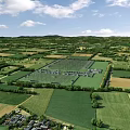 Aerial Rural Landscape with Green Farmland Neat Fields Distant Hills and White Clouds