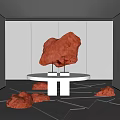 Red Carved Sculptures In Modern White Gallery With Round Table And Floor Artworks