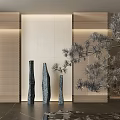 Three Dark Vertical Sculptures With Perforated Wall Background Soft Lighting And Metal Pine Decoration