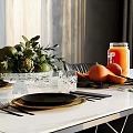 Fresh Fruits Arrangement on Modern Kitchen Dining Table With Oranges Apples Juice Jar and Cutlery