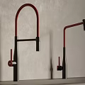 Two Red And Black Modern Kitchen Faucets Mounted On Countertop With Sleek Design