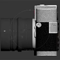 Vintage Electronic Camera With Silver Body Black Leather Surface And Large Classic Lens