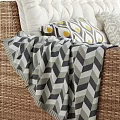 Rattan Outdoor Sofa with White Cushions Geometric Pillows and Throw Blanket
