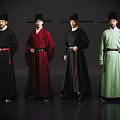 Men In Traditional Robes And Hats Standing In Various Colored Attire