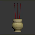 Golden Decorative Incense Burner With Three Red Incense Sticks On Dark Background