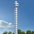 Tall Modern Tower With Glass Facade And Windows Against Clear Blue Sky