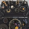 Elegant Black Tableware Collection With Fruits Candles And Wine Glasses On Table