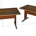 Two Rustic Wooden Tables With Patterned Tops And Dark Angled Legs