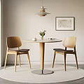 Round Wooden Table and Chairs with Black Seats Vase Flowers Wall Art and Ceiling Lamp