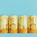 Refreshing Orange Soda Canned Drinks With Orange Fruit Design And Light Blue Background