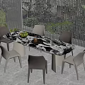 Modern Dining Table Surrounded by Six Chairs With Fruits Plate Plants and Window Blinds