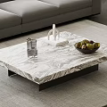 Modern Marble Coffee Table With Glass Cup Sculpture And Green Fruit Bowl In Living Room