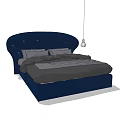 Navy Blue Double Bed With Curved Upholstered Headboard And Gray Bed Linens