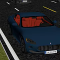Luxury Blue Maserati Sports Car With Red Interior Driving On Road